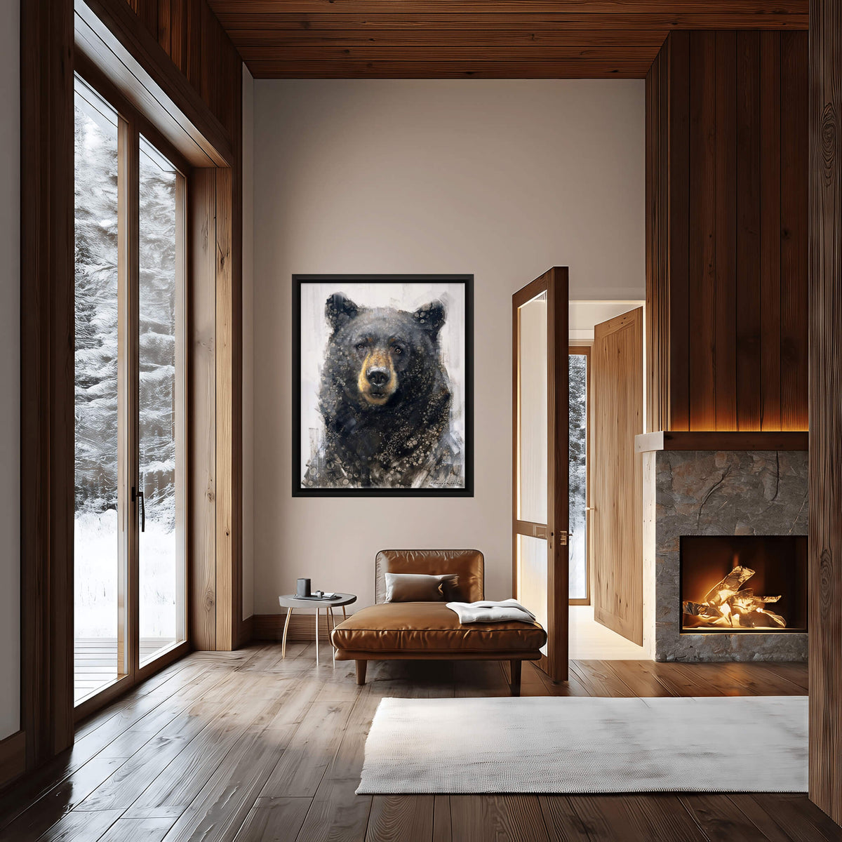 A framed black-and-white bear portrait hangs on a beige wall in a modern cabin-style living room with wood floors, a leather lounge chair, and a stone fireplace.