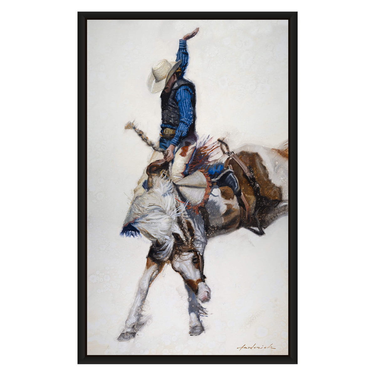 A framed vertical art print depicting a cowboy in a blue shirt and white hat riding a bucking horse, shown against a light neutral background with a black frame.