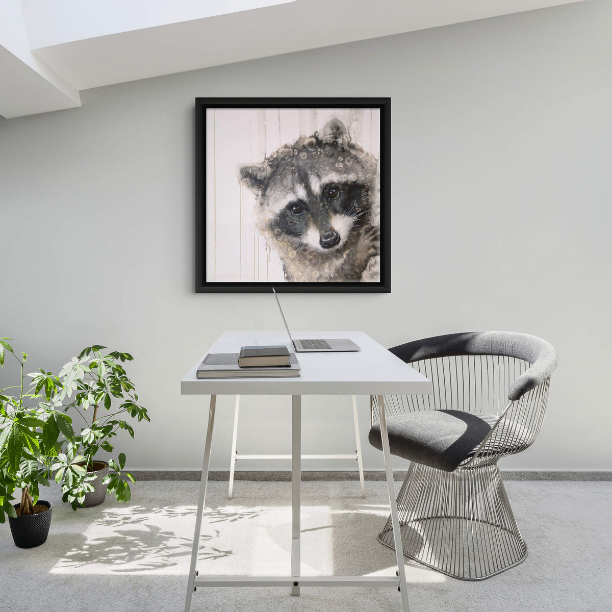 A square art print featuring a close-up portrait of a raccoon overlaid with a textured, paint-dripping effect on a pale pink background, framed by a wide white border.